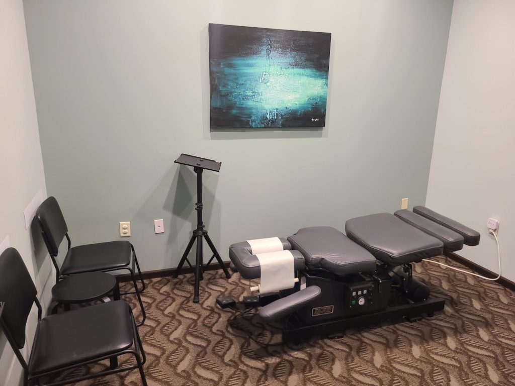 Chiropractic adjustment table used for patient care at Frankum Chiropractic